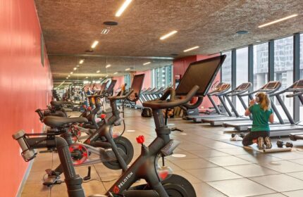 EAST Miami Gay-Friendly Hotel gym. Peloton bikes and treadmills offer a workout with a view. Modern fitness center for hotel guests.