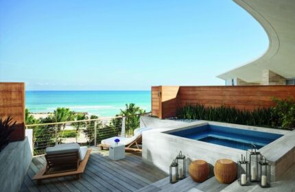 Miami Beach EDITION gay-friendly hotel suite with ocean view. Relax on the deck with lounge chairs and a private plunge pool. Luxury gay travel.