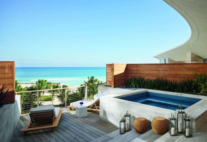 Miami Beach EDITION gay-friendly hotel suite with ocean view. Relax on the deck with lounge chairs and a private plunge pool. Luxury gay travel.