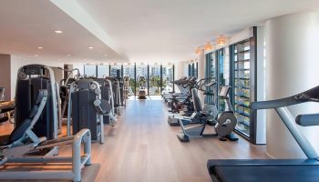 W South Beach gay-friendly hotel gym. Cardio and weight machines with city views. A great place to work out during your gay travel vacation.