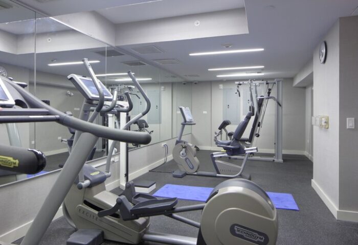 Hotel Breakwater South Beach gay-friendly gym. Exercise equipment includes elliptical, stationary bike, and weight machine.