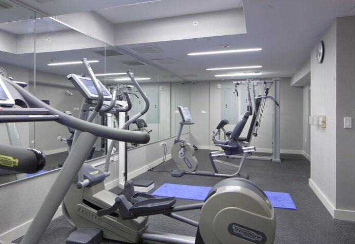 Hotel Breakwater South Beach gay-friendly gym. Exercise equipment includes elliptical, stationary bike, and weight machine.