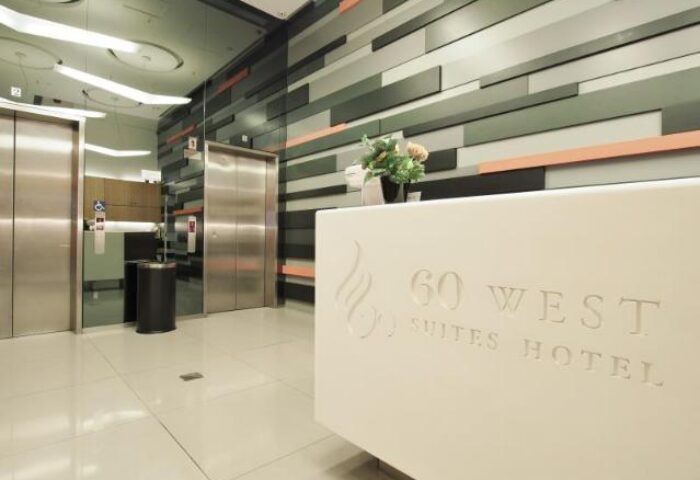 60 West Hotel lobby. Gay-friendly hotel with modern design, reception desk, elevators. A stylish and welcoming space for gay travelers.
