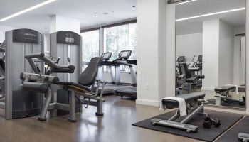 The Modern Honolulu Hilton Vacation Club gym. Gay-friendly hotel fitness center with weight machines, treadmills, and free weights.