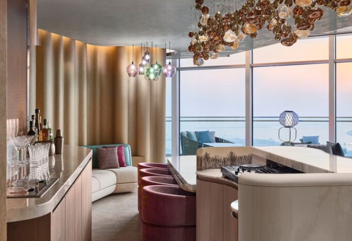 Stylish bar area at W Dubai - Mina Seyahi, a gay-friendly hotel. Features modern design, plush seating, and stunning views. #DubaiHotel #GayTravel