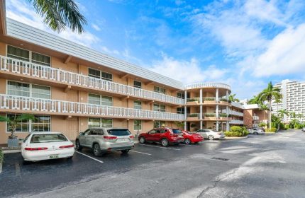 Coconut Bay Resort: Exterior view of a gay-friendly hotel with balconies and parking. A welcoming destination for gay travelers.