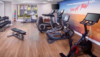 The Reach Key West gym with weights, treadmills, & stationary bike. You conquered Duval Street last night...You got this! Gay-friendly hotel.