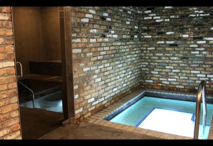 The Gaythering gay-friendly hotel crates: Spa area with brick walls and small pools. A great place for gay travel and relaxation.
