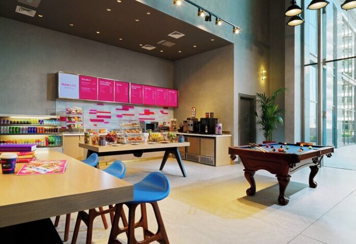Aloft Palm Jumeirah's stylish interior. This gay-friendly hotel features a cafe, pool table, and modern design. Perfect for LGBTQ+ travelers.