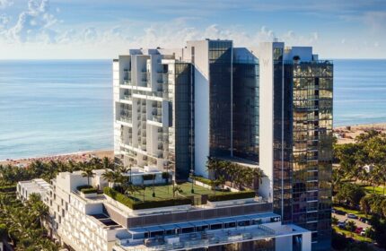 W South Beach, a gay-friendly hotel. Aerial view of the luxury resort with ocean views, palm trees, and modern architecture. Perfect for gay travel.