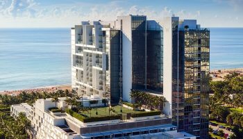 W South Beach, a gay-friendly hotel. Aerial view of the luxury resort with ocean views, palm trees, and modern architecture. Perfect for gay travel.