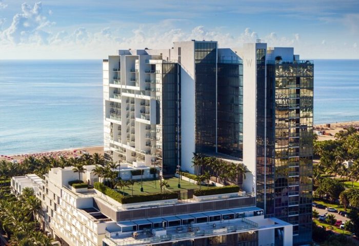 W South Beach, a gay-friendly hotel. Aerial view of the luxury resort with ocean views, palm trees, and modern architecture. Perfect for gay travel.
