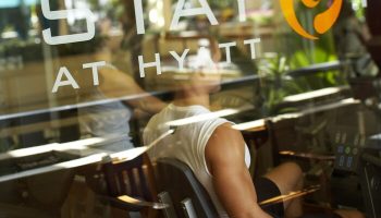 Gay-friendly Hyatt Regency Waikiki gym. Man works out. Waikiki Beach Resort and Spa fitness center. Travel advice for gay men.