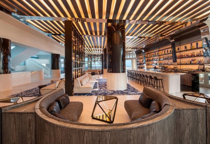W Fort Lauderdale gay-friendly hotel interior. Modern design with bar, seating areas, and unique lighting. Upscale decor for gay travelers.