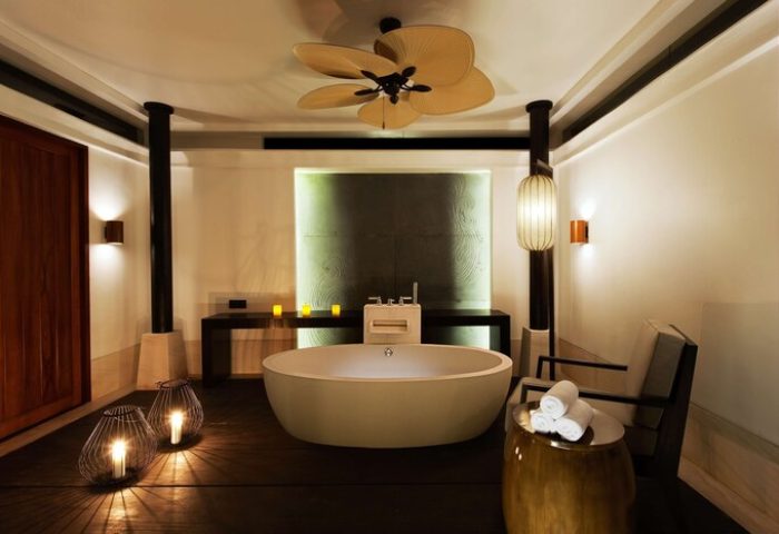 The Barai Hyatt's luxurious bathroom. This gay-friendly hotel features a modern tub, soft lighting, & stylish decor for a relaxing getaway.