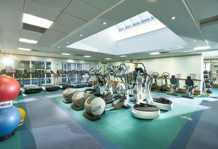 Crieff Hydro gay-friendly hotel gym. Treadmills, elliptical trainers, and exercise balls under a skylight. Fitness center for gay men's travel.