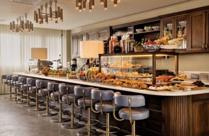 Soho House Istanbul's stylish bar area. A gay-friendly hotel with pastries, fruit, and comfortable seating. Perfect for gay men travel.