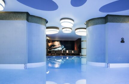 Indoor pool at The Elysium Taksim Hotel, a gay-friendly hotel. Relaxing spa area with lounge chairs. Perfect for gay travel in Istanbul.