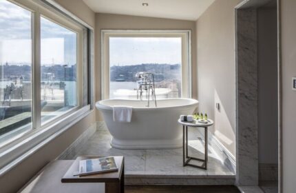 The Bank Hotel Istanbul bathroom. Gay-friendly hotel with a soaking tub, city view, and marble accents. Design Hotels™ Istanbul gay travel.
