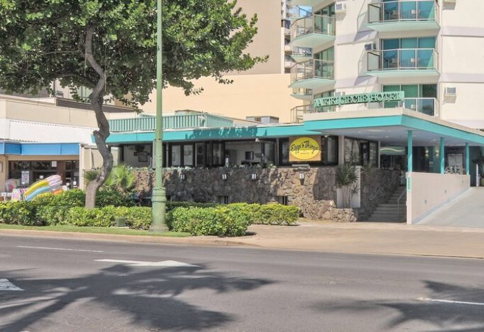 Aston Waikiki Circle Hotel exterior. Gay-friendly hotel with Eggs 'n Things restaurant. Waikiki travel advice for gay men.
