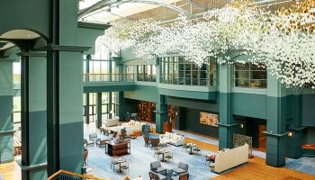 Fairmont St Andrews, Scotland: Grand interior of this gay-friendly hotel. View of the lobby with seating areas and a unique chandelier.