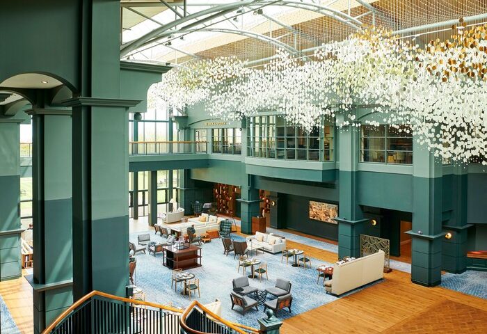 Fairmont St Andrews, Scotland: Grand interior of this gay-friendly hotel. View of the lobby with seating areas and a unique chandelier.