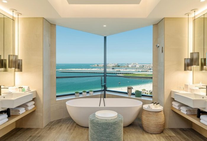 Le Royal Méridien Beach Resort & Spa gay-friendly hotel bathroom. Bathtub with ocean view. Luxury gay travel in Dubai.