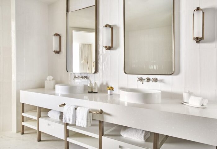 Four Seasons Hotel Fort Lauderdale: Modern, all-white bathroom with double sinks, large mirrors, and stylish fixtures. Gay-friendly hotel travel.