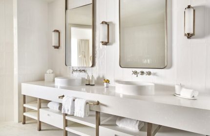 Four Seasons Hotel Fort Lauderdale: Modern, all-white bathroom with double sinks, large mirrors, and stylish fixtures. Gay-friendly hotel travel.