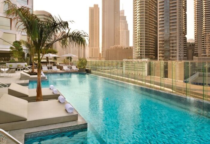 Hotel Indigo Dubai Downtown pool. Gay-friendly hotel with skyline view. Relaxing pool scene at a top Dubai hotel. Gay travel in Dubai.