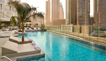 Hotel Indigo Dubai Downtown pool. Gay-friendly hotel with skyline view. Relaxing pool scene at a top Dubai hotel. Gay travel in Dubai.