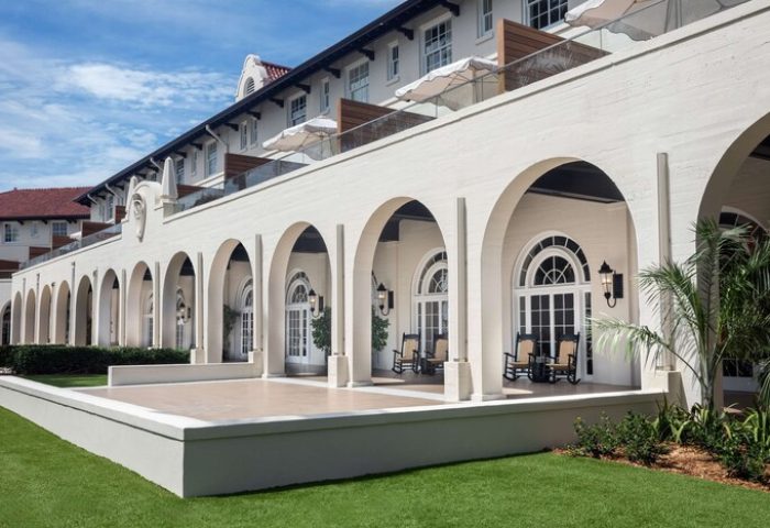 Casa Marina Key West, Curio Collection by Hilton, a gay-friendly hotel. Arches line the exterior of this luxury resort. Balconies visible.