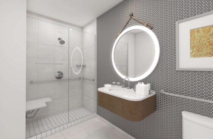 The Reach Key West, Curio Collection by Hilton gay-friendly hotel bathroom. Shower with seat, round mirror, and modern sink.