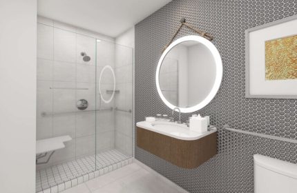 The Reach Key West, Curio Collection by Hilton gay-friendly hotel bathroom. Shower with seat, round mirror, and modern sink.