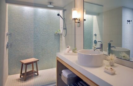 Hyatt Centric Key West Resort bathroom. Walk-in shower with blue mosaic tile. Modern sink and vanity. Gay-friendly hotel bathroom.