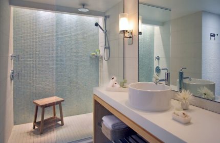 Hyatt Centric Key West Resort bathroom. Walk-in shower with blue mosaic tile. Modern sink and vanity. Gay-friendly hotel bathroom.