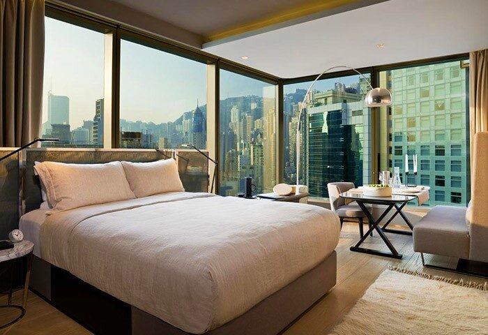 99 Bonham gay-friendly hotel room. Modern design with city views. Comfortable bed, dining area. Ideal for gay travelers seeking style.