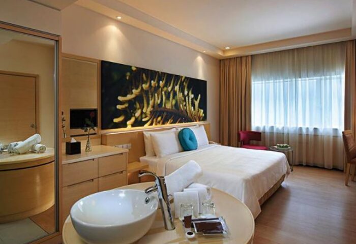 ANSA Hotel Kuala Lumpur room. Gay-friendly hotel with modern design, featuring a bed, sink, and natural light. Ideal for gay travelers.