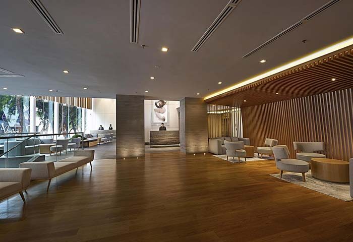 ANSA Hotel Kuala Lumpur lobby. Gay-friendly hotel with modern design, wood accents, and seating areas. Ideal for gay men travelers.