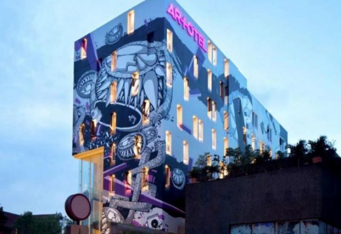 ARTOTEL Thamrin Jakarta exterior. Gay-friendly hotel with mural art. Modern design in Jakarta, Indonesia. Urban travel.