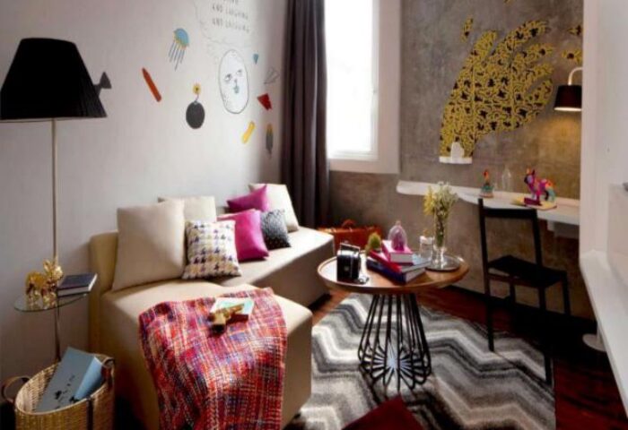 ARTOTEL Thamrin Jakarta room: Stylish, gay-friendly hotel with modern decor, colorful artwork, and cozy seating for a comfortable stay in Jakarta.