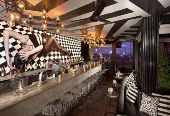 ARTOTEL Thamrin Jakarta's stylish bar. This gay-friendly hotel features a chic design, drinks, and a vibrant atmosphere.