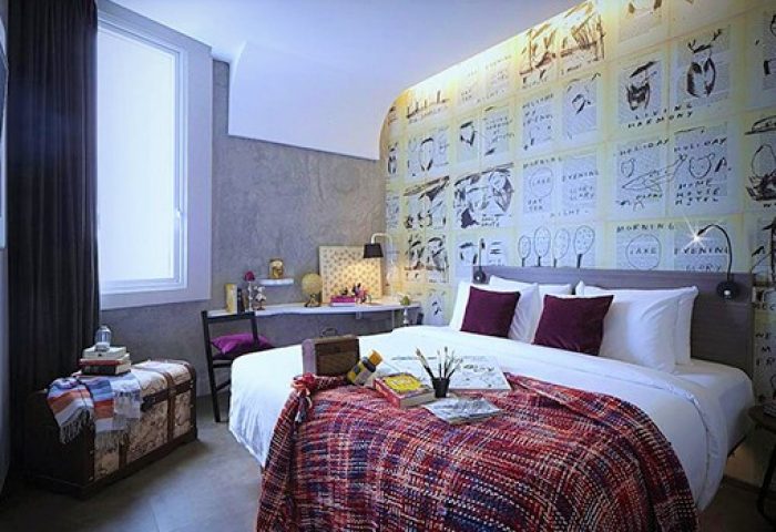 ARTOTEL Thamrin Jakarta gay-friendly hotel room. Modern design, bed with art, desk, and trunk. Great for gay men travelers.