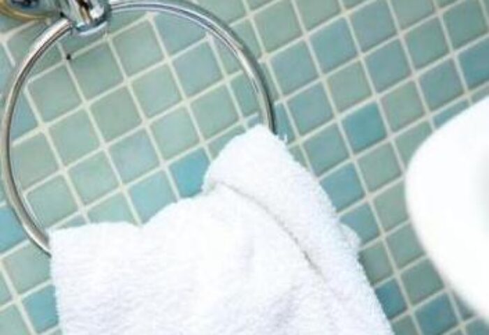 Abbey Court Hostel detail: Bathroom towel on a holder. Gay-friendly hotel with modern, clean amenities for gay men travelers. Budget-friendly.