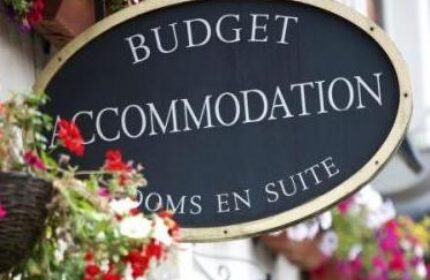 Abbey Court Hostel sign. Budget accommodation for gay travelers. Gay-friendly hotel with rooms en suite. Travel advice for gay men.