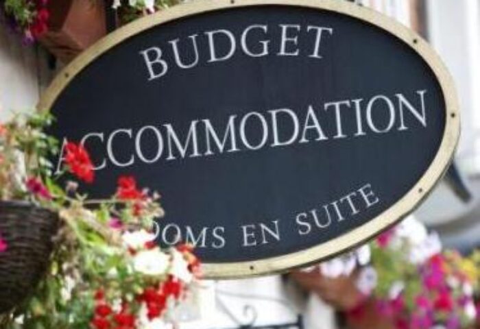Abbey Court Hostel sign. Budget accommodation for gay travelers. Gay-friendly hotel with rooms en suite. Travel advice for gay men.