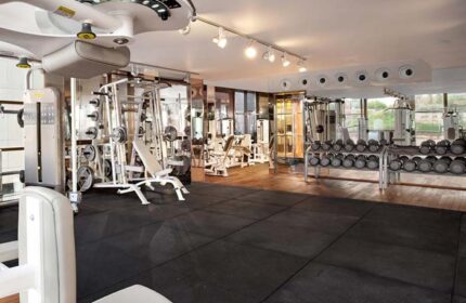 Gym at Alexander Tel Aviv Hotel, a gay-friendly hotel. Fitness center with weights, machines, and mirrors. Perfect for gay men's travel.