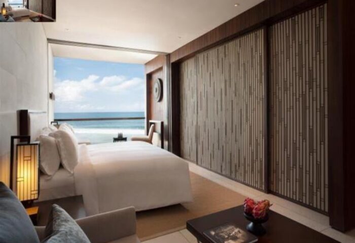 Alila Seminyak gay-friendly hotel room with ocean view. Modern design, neutral tones, and a serene atmosphere. Ideal for gay travelers.