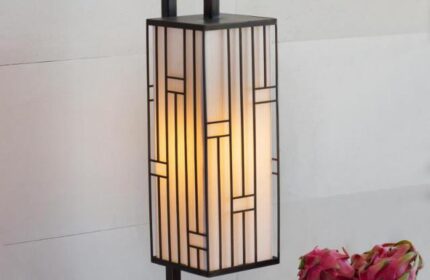Stylish lamp at Alila Seminyak, a gay-friendly hotel. The lamp has a geometric design and soft lighting, creating a relaxing ambiance.