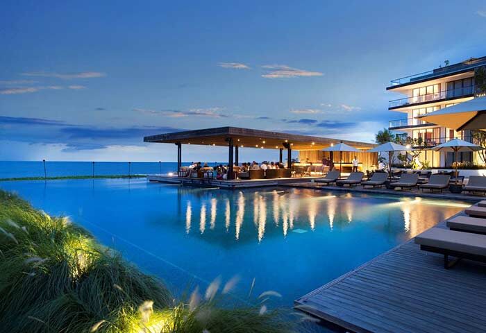 Alila Seminyak, a gay-friendly hotel. Poolside bar, ocean view, and modern architecture. A perfect Bali getaway for gay travelers.